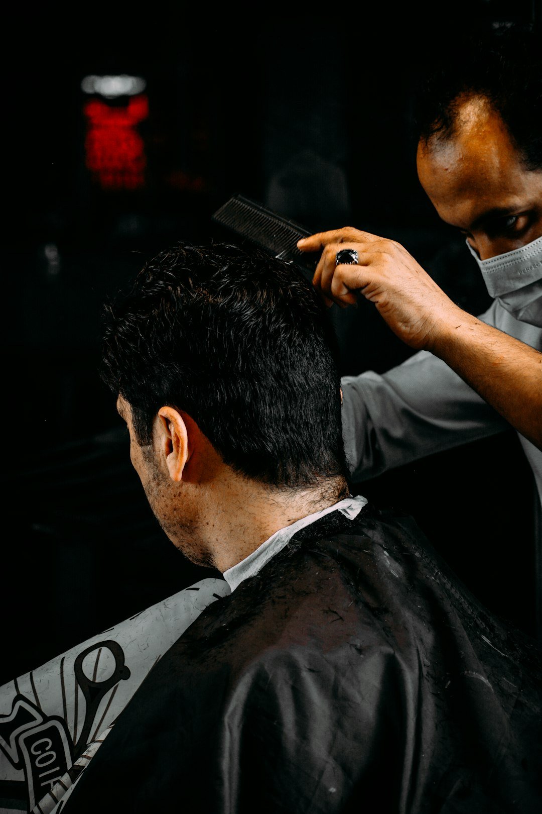 a-man-holding-a-microphone-to-another-mans-ear-av4hfd-i2sq